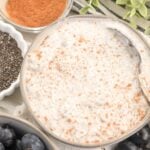 close up of cottage cheese chia pudding topped with cinnamon.
